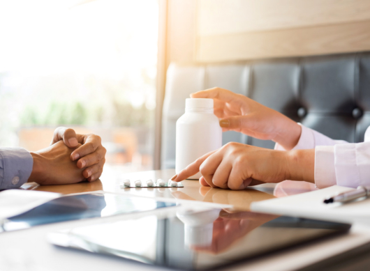 doctor hand holding tablet of drug
